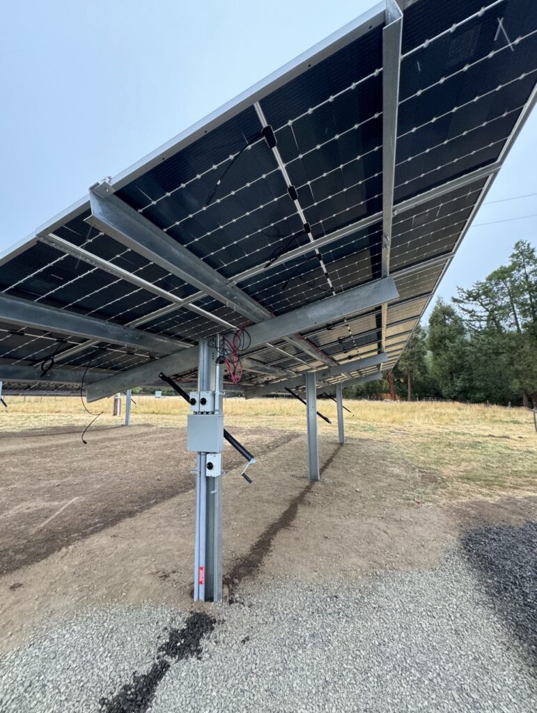 A solar panel sitting on top of a metal structure.